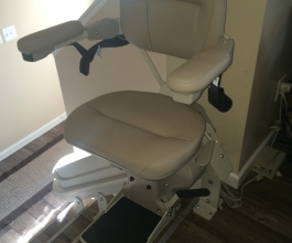 Curved stairlift at the top of the stairs