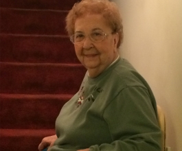 Woman sitting on stairlift in Richmond, IN