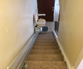 Stair chair at the bottom of the stairs